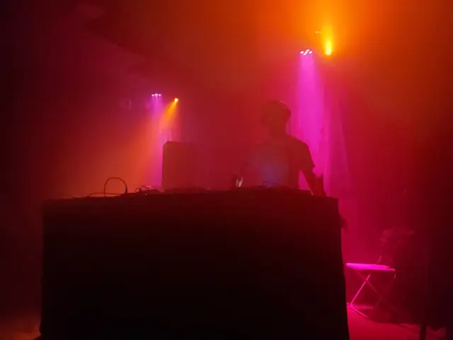 Cue.bitch behind the decks